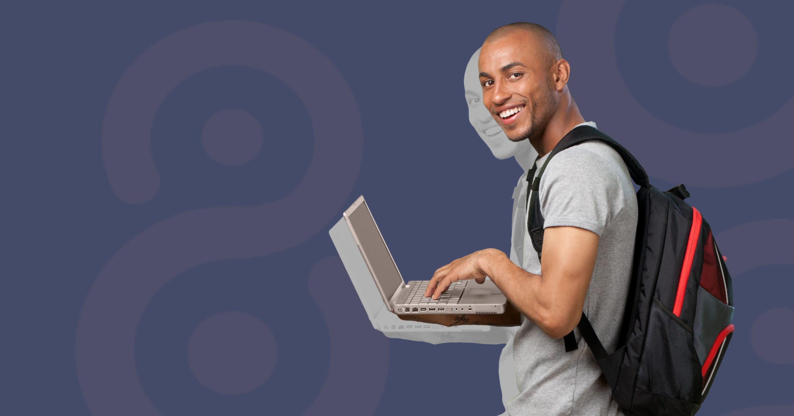 Smiling man with backpack holding laptop