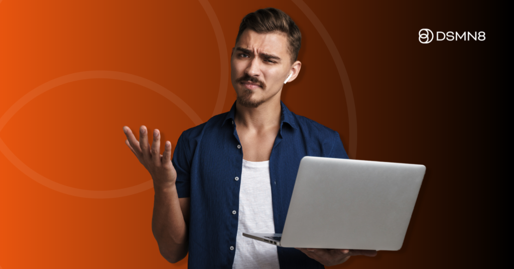 confused employee holding laptop