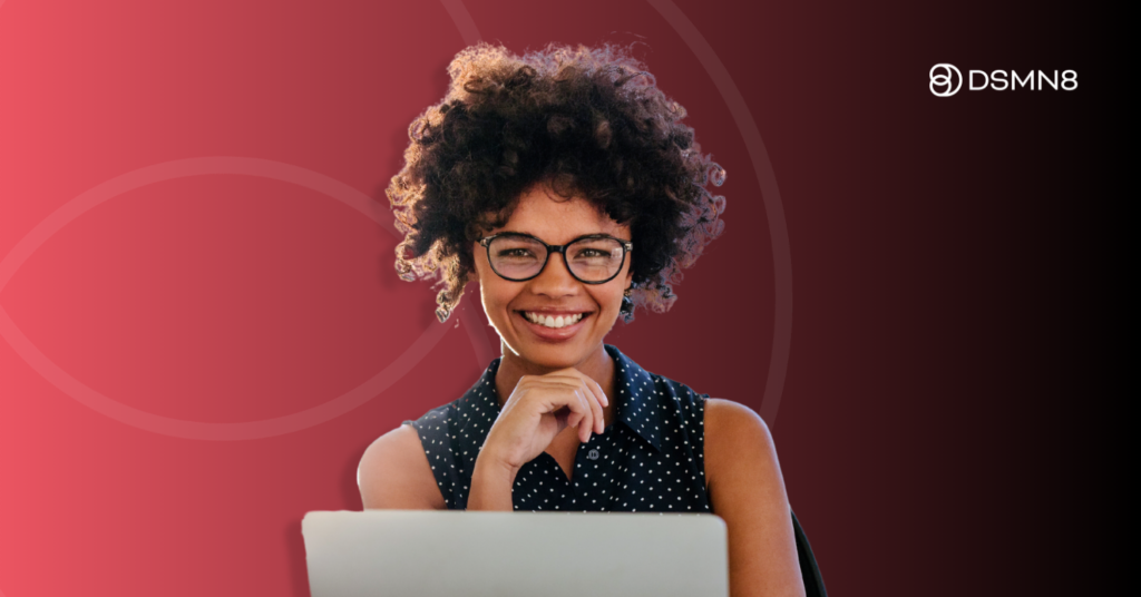 woman smiling looking at computer