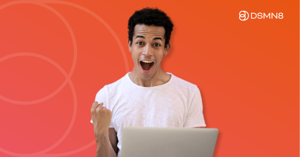 happy man holding laptop