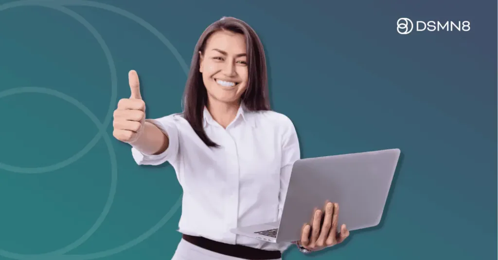 professional woman holding laptop with thumbs up