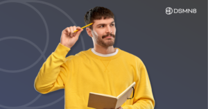 employee thinking holding pencil and notebook