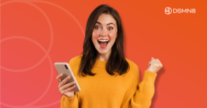 happy employee celebrating holding phone