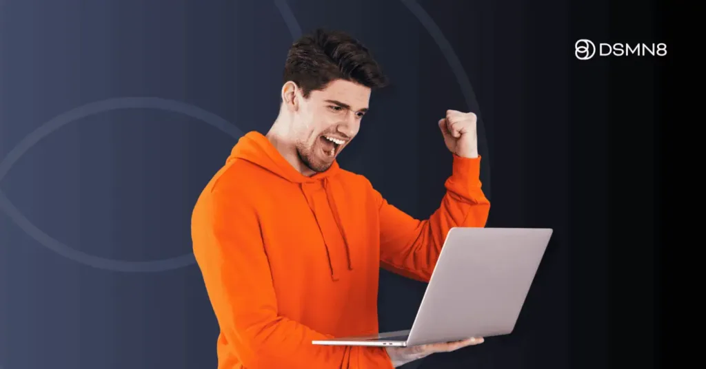 celebrating employee holding laptop